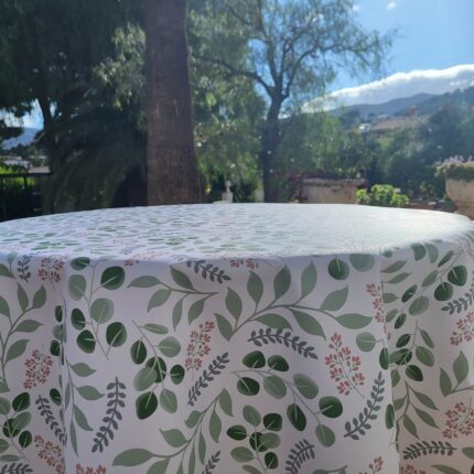 Mantel hule redondo con hojas